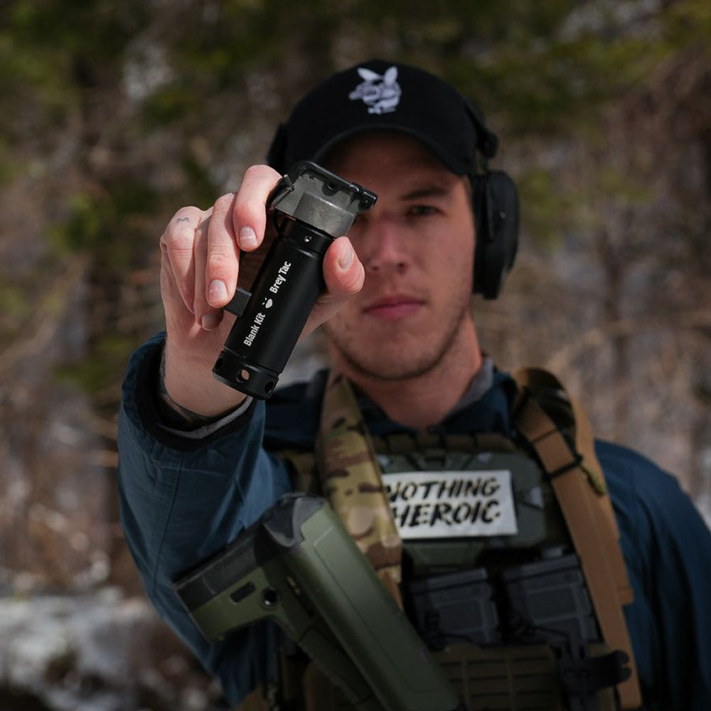 Person in tactical gear holding Blank Kit